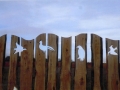 Carved fence with bird pattern